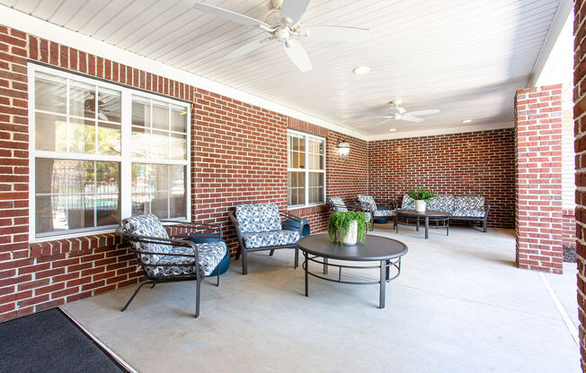 the preserve at ballantyne commons covered patio with chairs and a table