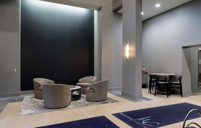 Grab a book and relax in the modern lobby at Midtown Crossing Apartments in Omaha.