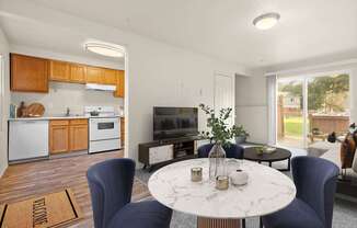 A modern kitchen with a dining table set for two.