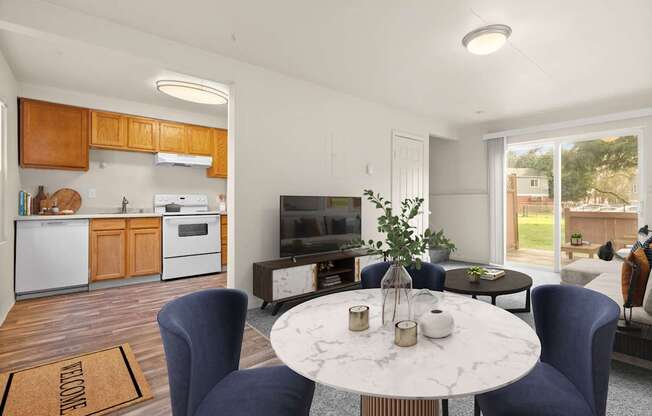 A modern kitchen with a dining table set for two.
