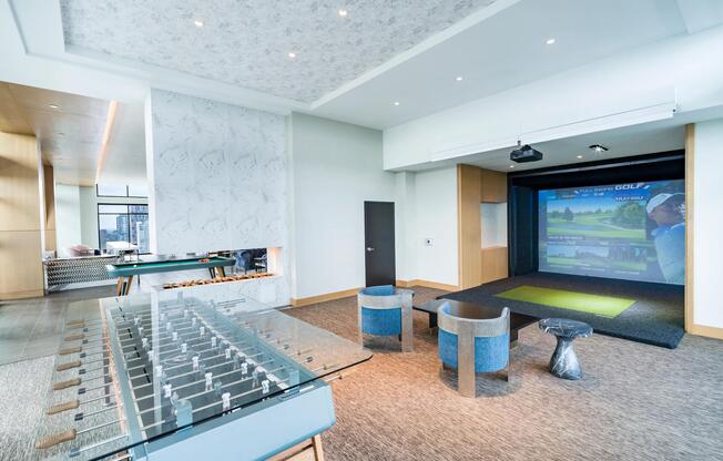 A resident lounge featuring a Full Swing Golf simulator creates a social setting for play and connection.