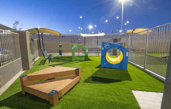 Pet park with agility equipment.