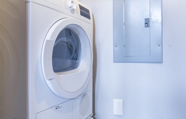 a washing machine and a dryer in a laundry room