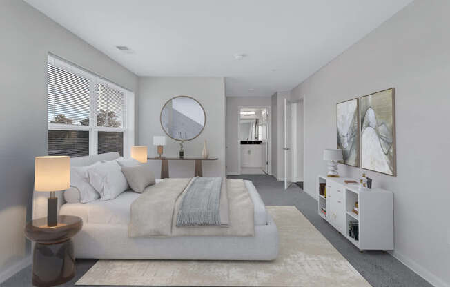 a bedroom with a bed and a mirror in a white room