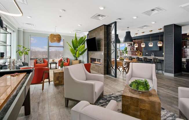 A modern living room with a pool table and comfortable seating.