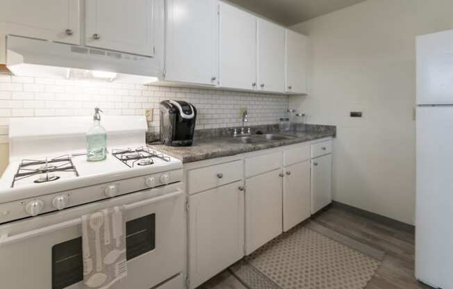 This is a photo of the kitchen of the 1 bedroom, 631 square foot model apartment at Lake of the Woods Apartments in Cincinnati, OH.