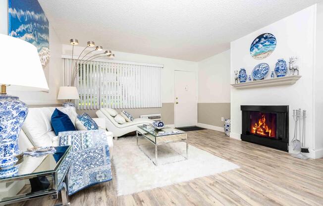 a living room filled with furniture and a fire place