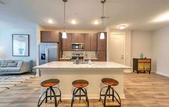 a kitchen with a counter top next to a living room at Luxor Club, Jacksonville, FL, 32258