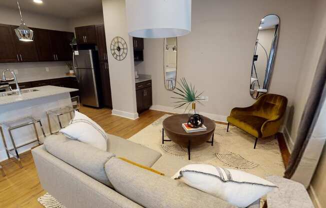 a living room with a couch and a table at The Fitzroy San Marcos, San Marcos, TX