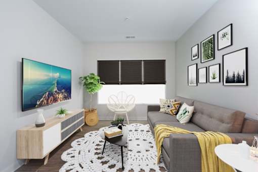 a living room with a gray couch and a yellow blanket at Fairfax, Ohio, 43212