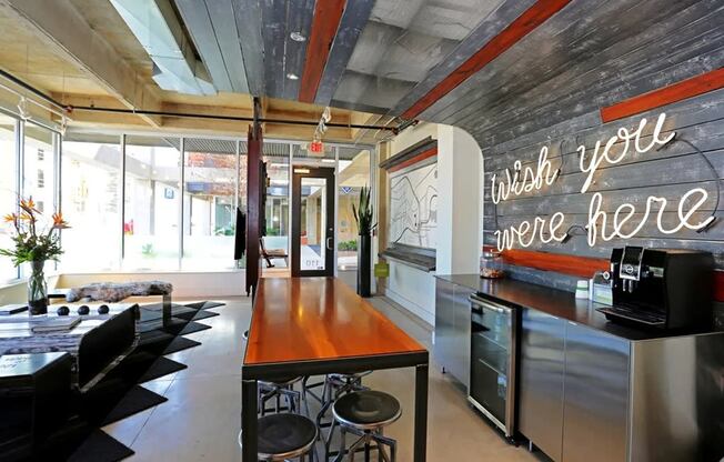 a kitchen and living room with a large sign that says which you are here