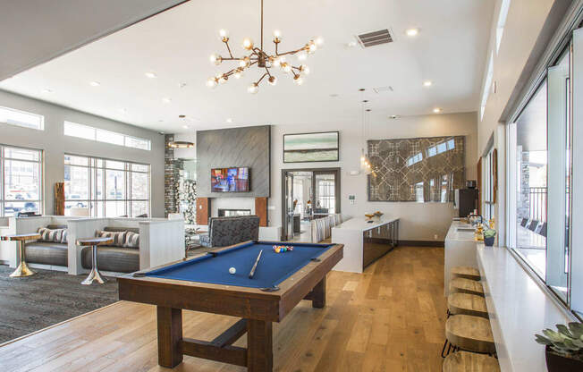 Clubhouse with kitchen and bar top, pool table and private booths