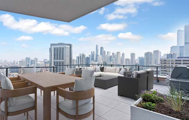 a terrace with a table and chairs and a view of the city at Cassidy on Canal, Chicago, 60606