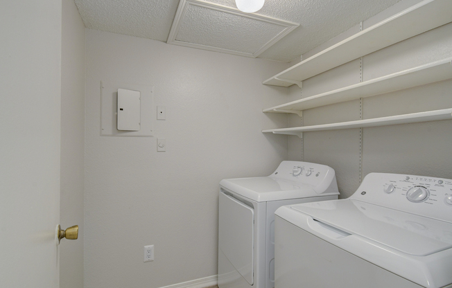 Walk-in pantry with washer and dryer at Rainbow Ridge Apartments in Kansas City, Kansas