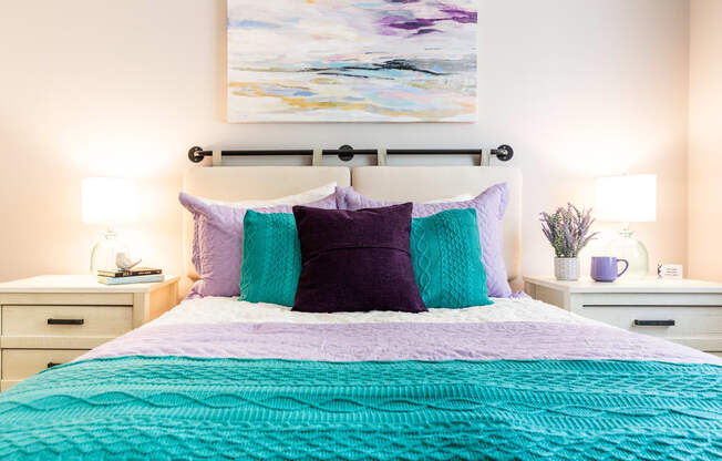 a bedroom with a bed and two night stands