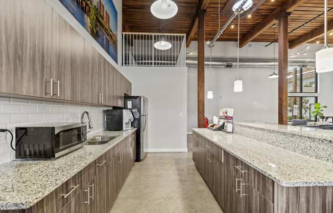 a kitchen with granite countertops and stainless steel appliances