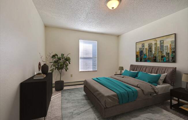 Bedroom with a bed and a dresser and a window at Park Place Apartments in Fargo, ND, 58103