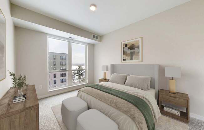 A bedroom with a large bed and a window overlooking a cityscape.