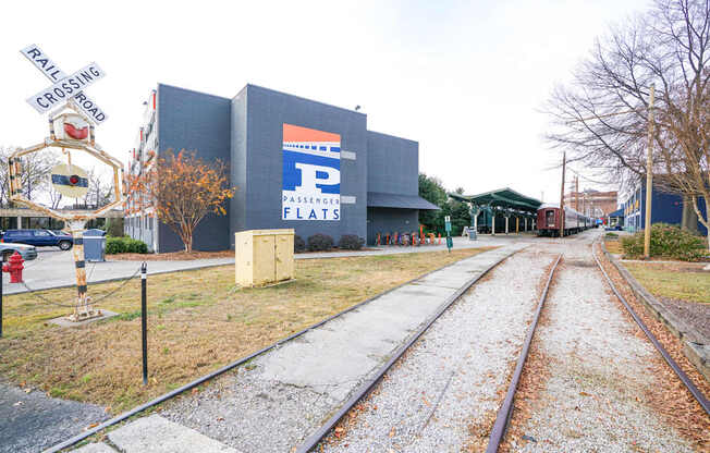 A railroad track with a sign that says "PASSENGER FLATS" on the side of it.