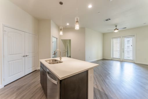 Kitchen Island With Pendent Lights at Residences at 3000 Bardin Road, Texas, 75052