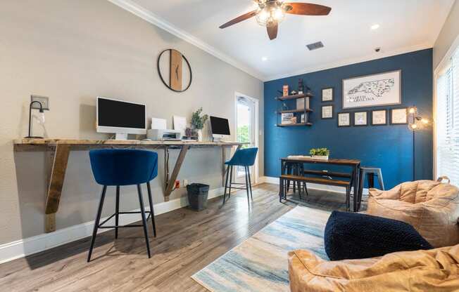 a home office with a computer desk and a couch