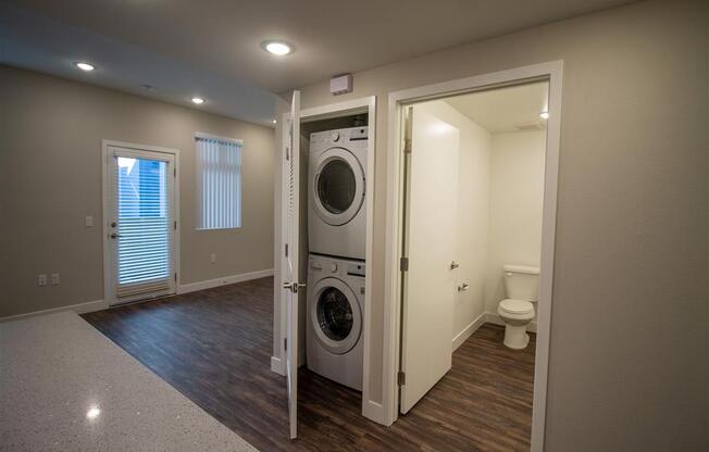 a room with a washer and dryer in it at Loma Villas Apartments in San Bernardino, CA