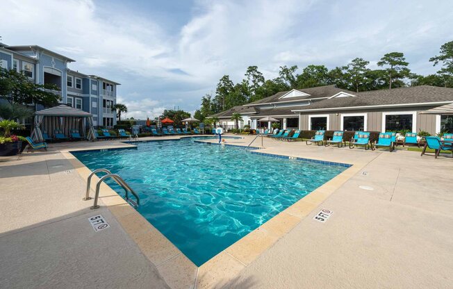 Myrtle Beach SC Apartments for Rent - Lattitude @ The Commons - Sparkling Pool Surrounded by Lounge Seating and a Poolside Cabana