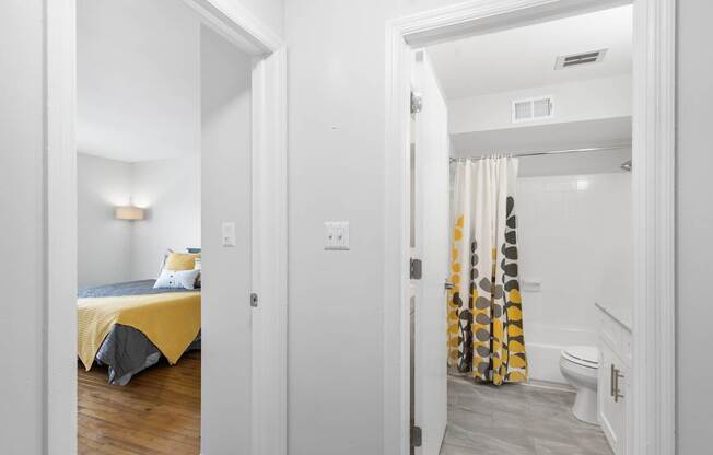 View of connected bedroom and bathroom layout at Monon Living in Broad Ripple, perfect for convenient living steps from the Monon Trail.