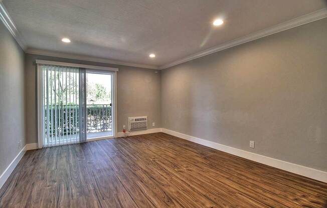 Living room with glass door view at The Luxe, Santa Clara, CA, 95051