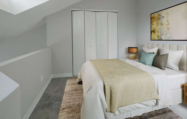 a bedroom with a bed and a closet