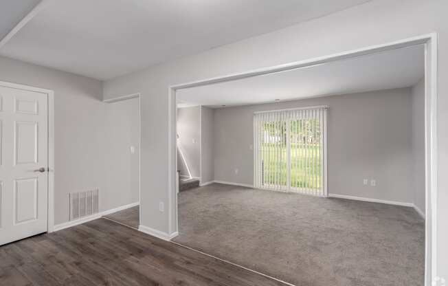 the living room and dining room of an apartment