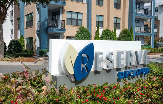 A sign for Reserve Decatur in front of a building.
