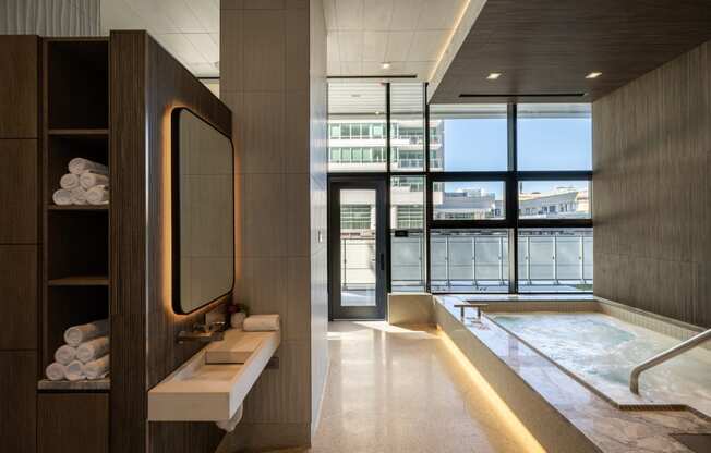 a bathroom with a large window and a bathtub