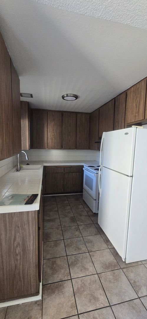 3 Bedroom, 1.5 Bath Two-Story Townhome with Private Patio
