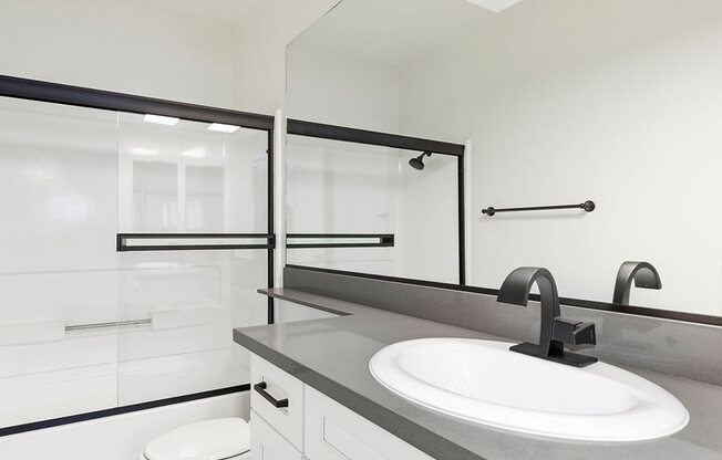 Modern styled bathroom with shower and tub.