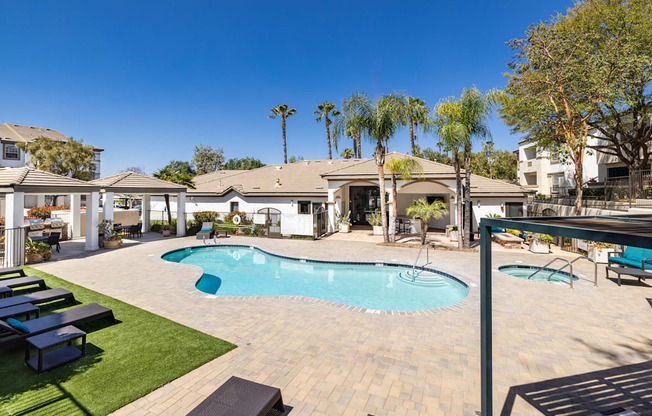 A large house with a pool in the backyard.
