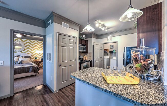 a kitchen with a counter top and a fish tank  at Waterstone at Cinco Ranch, Texas