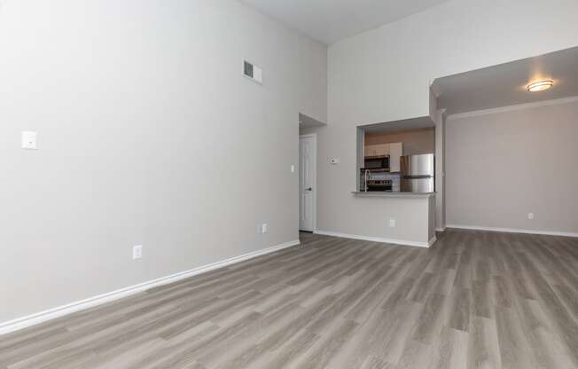 a bedroom with hardwood flooring at the whispering winds apartments in pearland, tx