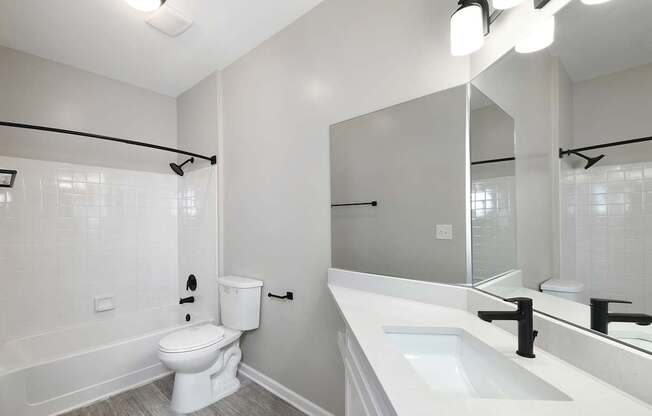 Bathrooms with quartz countertops and designer light fixtures (Legacy)