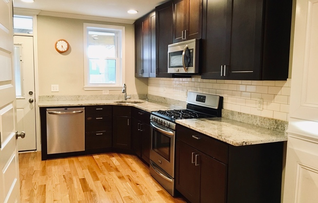 Charming 2 Bedroom/3 Bathroom Townhome w/ Den and In-Unit Laundry in Locust Point, MD! - Parking Pad!