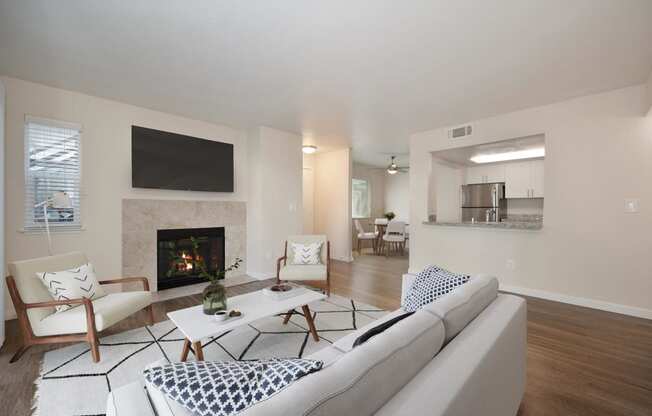 a living room with a fireplace and a couch