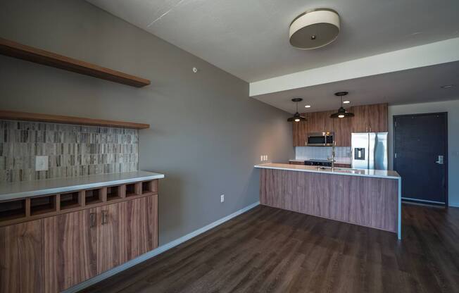 A kitchen with wooden cabinets and a countertop.