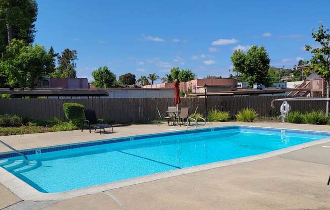 Invitiing pool and sun deck at Plaza Verde Apartments in Escondido, California.