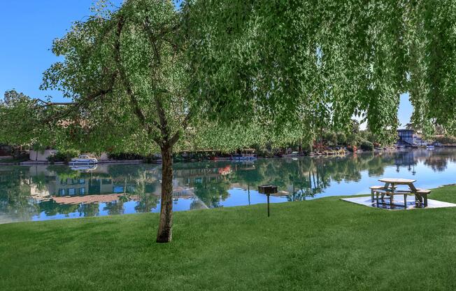 a group of lawn chairs sitting on top of a body of water