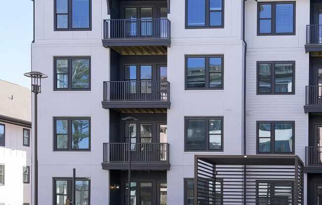 Apartments with balconies overlooking the beautiful pool area at Novel Cary