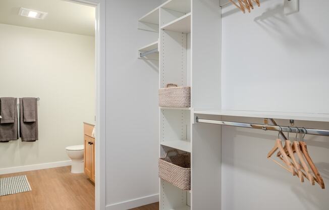 a walk in closet in a bathroom with a toilet at Slabtown Square Apartments, Oregon