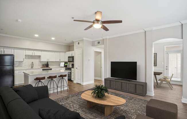 a living room with a couch and a tv at The Verandah, Texas, 78726