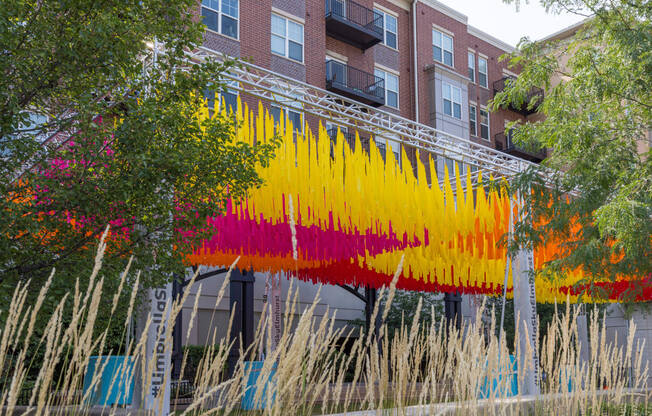 a building with rainbow paint in front of it