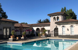 a house with a swimming pool in front of it  at Falcon Bridge at Gale Ranch, San Ramon, CA