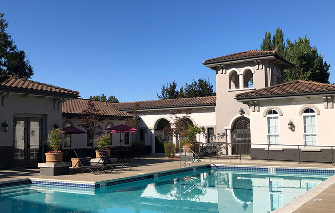 a house with a swimming pool in front of it  at Falcon Bridge at Gale Ranch, San Ramon, CA